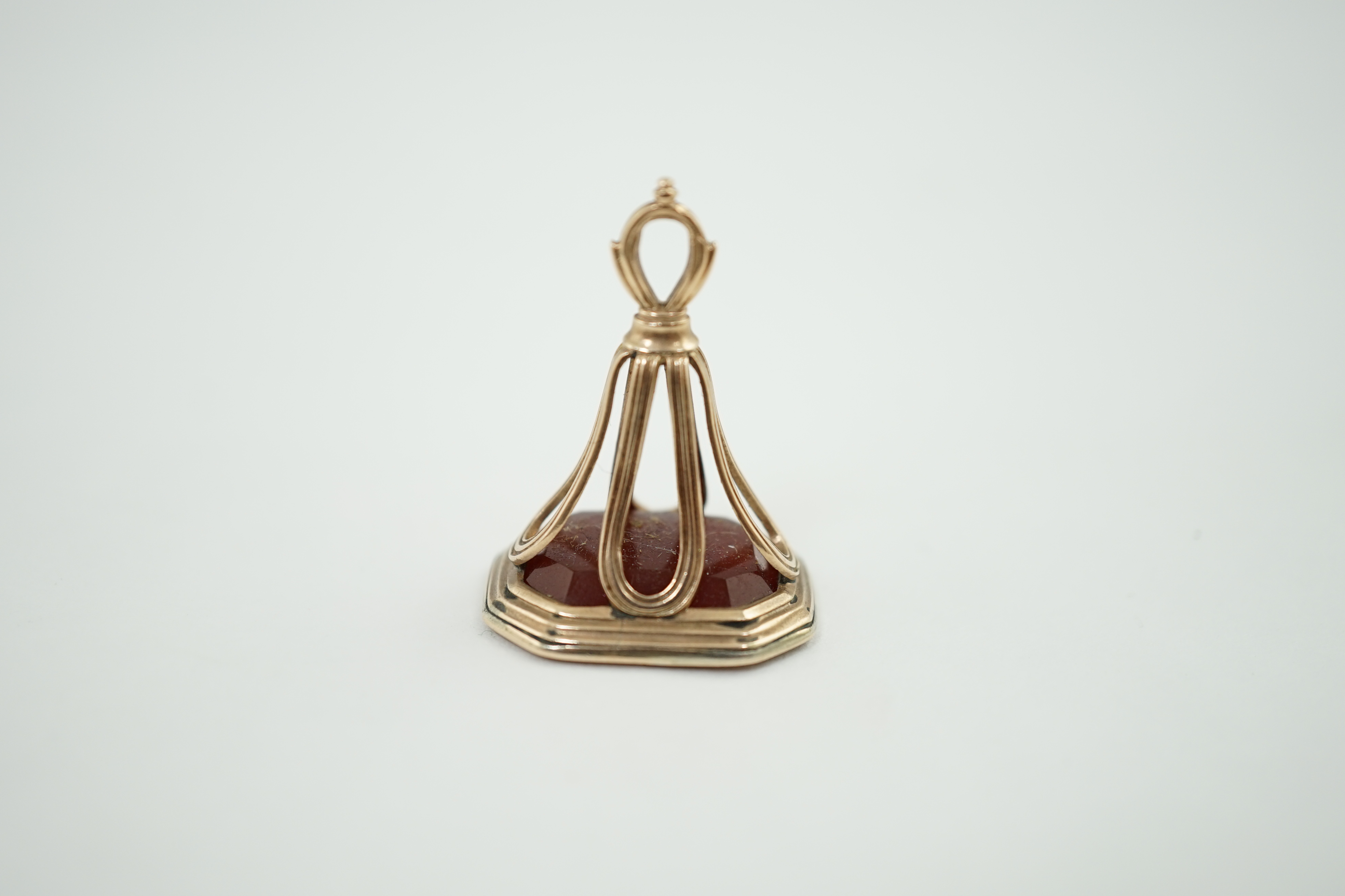 An early 19th century gold overlaid intaglio fob seal, with agate matrix engraved with a portrait bust of a 16th century gentleman, possibly Shakespeare, 3cm high. Condition - fair to good
